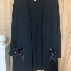 Black long cardigan sweater, with sequins pockets. Size Large